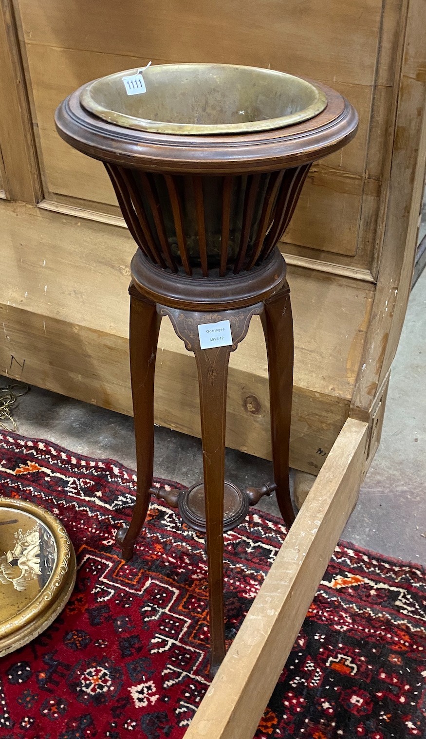 An Edwardian inlaid mahogany jardiniere with brass liner, height 93cm